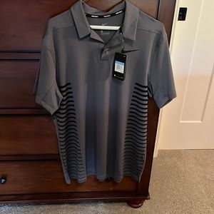 New with tags Nike men’s golf shirt. Size M. Gray with black horizontal stripes